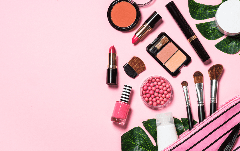 Assorted makeup products including foundation, blush, eyeshadow, and lipstick, featuring best makeup products, makeup items, and trendy makeup looks for a glowy, soft glam makeup aesthetic.