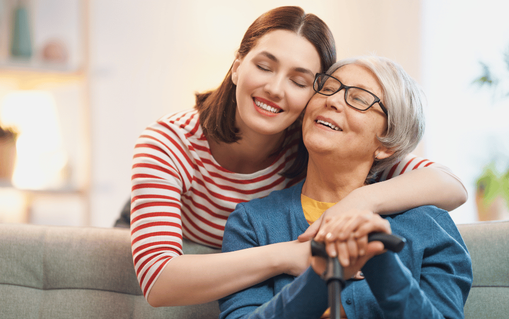 Self-care for moms – daughter hugging her mom to show love, support, and appreciation for all she does.