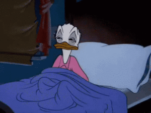 Donald Duck Falling asleep showing a sleep hygiene routine for mental health.