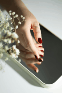 Burgundy New Year’s nails with a glossy elegant finish.