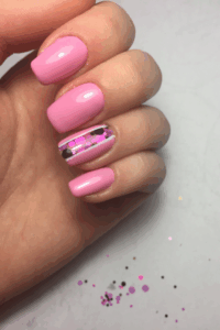 pink New Year’s nails with a glossy feminine finish.