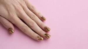 Shiny gold New Year’s nails perfect for a party-ready style.