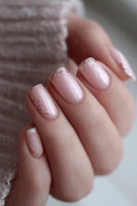 Close-up of glitter nails sparkling under bright light, featuring a festive shimmer and elegant finish, perfect for celebratory and stylish New Year’s nails.