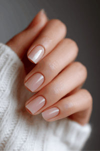 Close-up of minimal nails with a clean, neutral polish and simple elegant design, showcasing a timeless and understated manicure ideal for modern New Year’s nails.