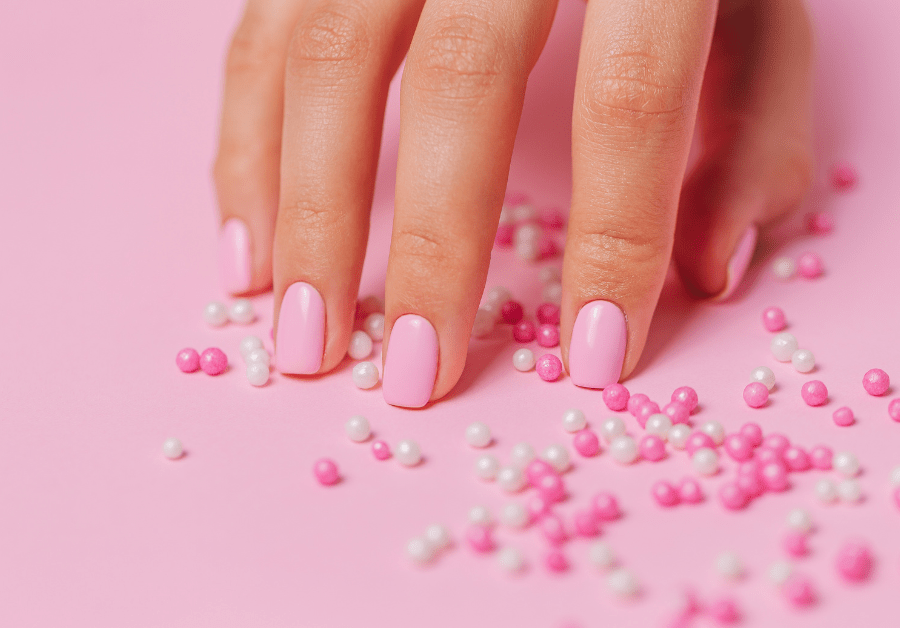 Elegant pink New Year’s nails design with a soft glossy finish.