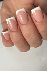 Close-up of square-shaped nails with a sleek glossy finish, styled in a modern and polished manicure perfect for stylish New Year’s nails.