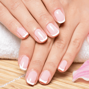 Short nails with a clean, minimalist look, styled as simple and chic Valentine’s Day nails.
