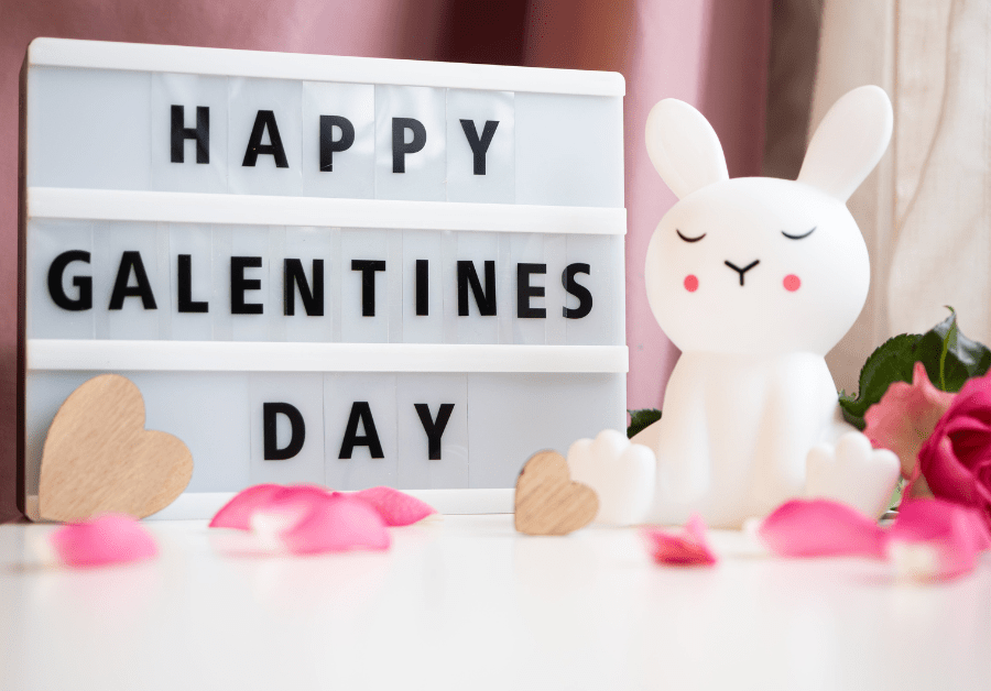 A happy galentine’s day setup with cute galentine's party ideas decor in a pink aesthetic.