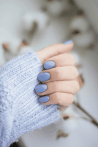 Short blue nails styled in a simple design for fresh spring nail ideas.
