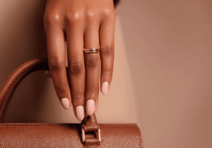 A stylish woman holding a chic handbag, showcasing bags for women and inspiring accessories ideas for a fashionable look.